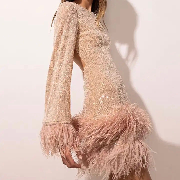 Valenzora | Glamorous sequined dress with feather hem detail