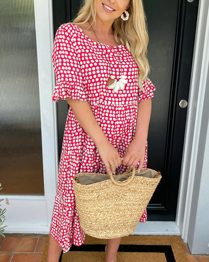 Midi dress with round neckline and polka dot print