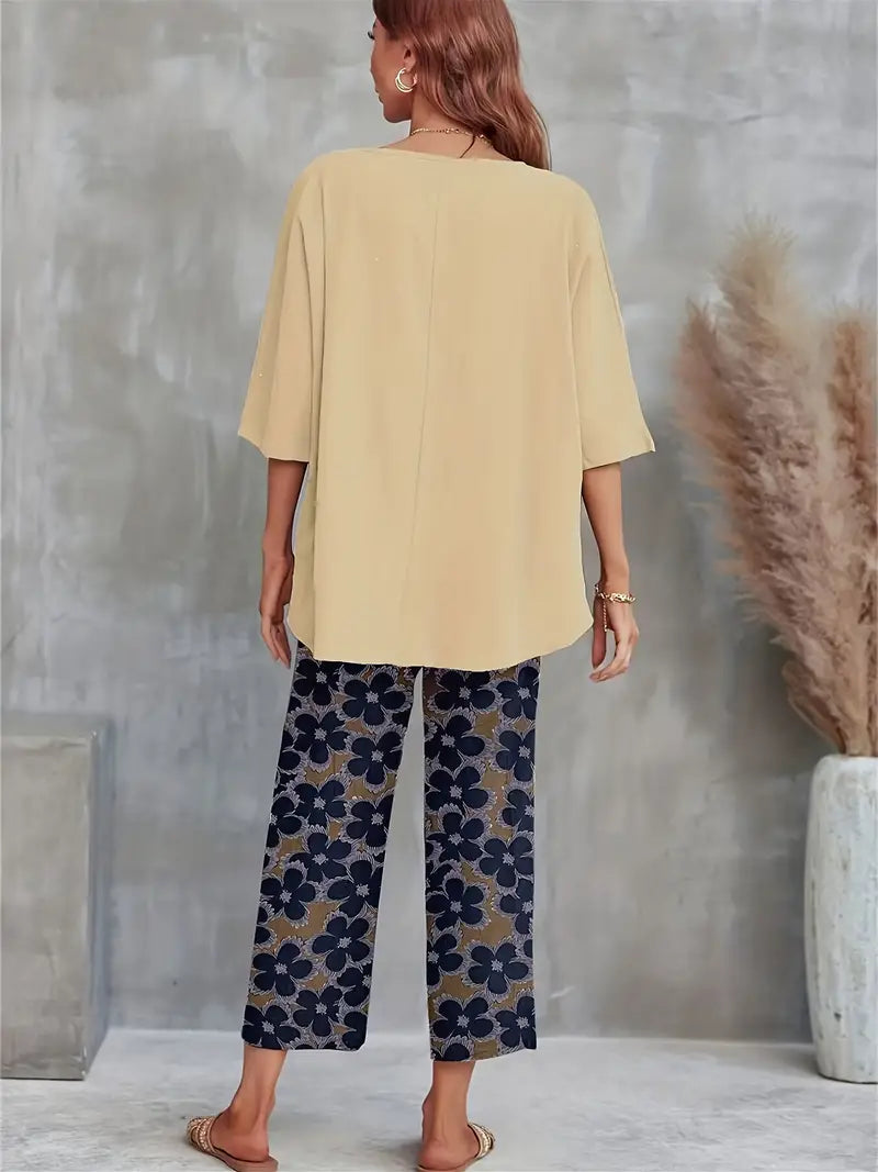 Valenzora | Solid T-shirt with wide legs and round neckline with floral motif