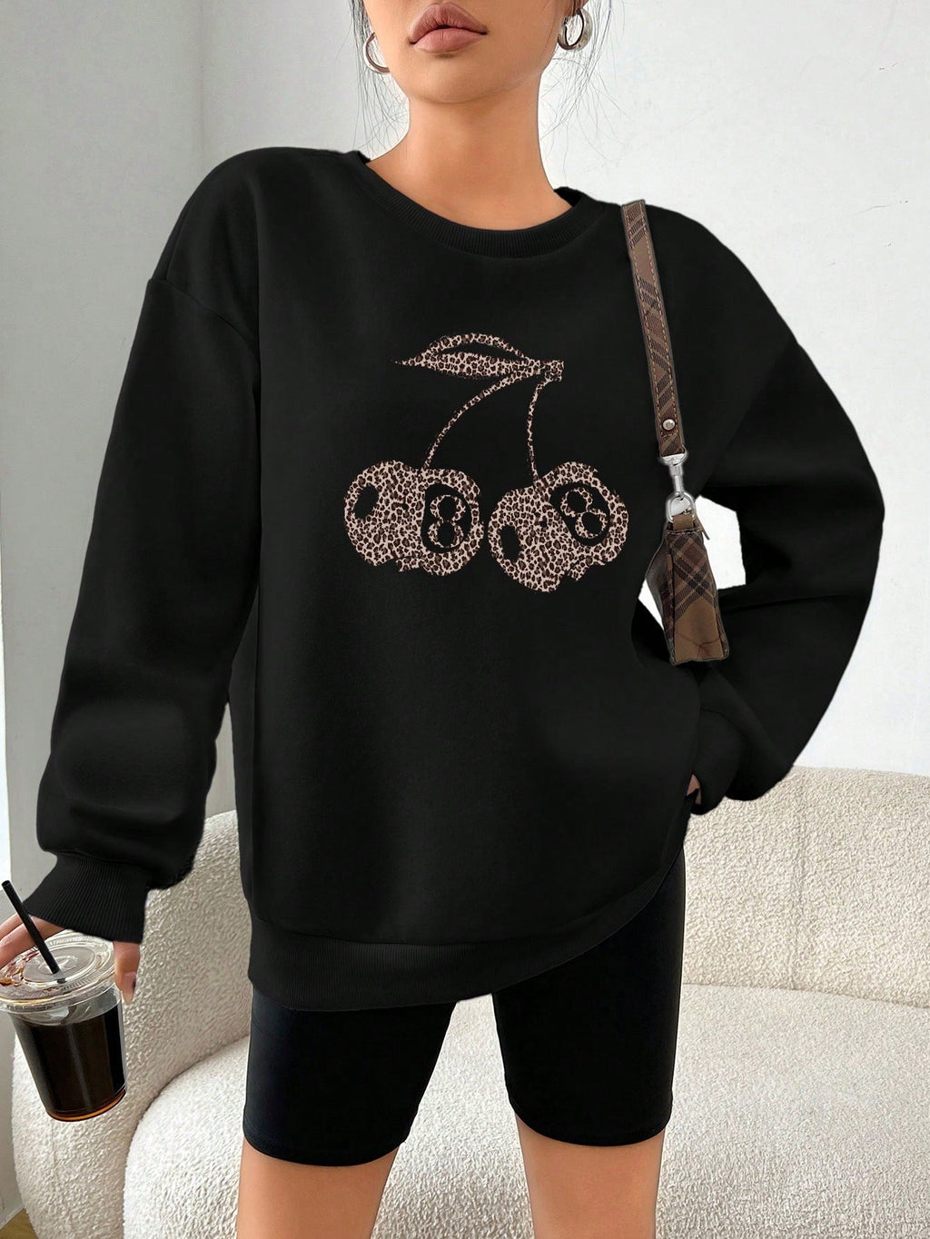 Valenzora | Casual leopard and cherry graphic sweatshirt in black