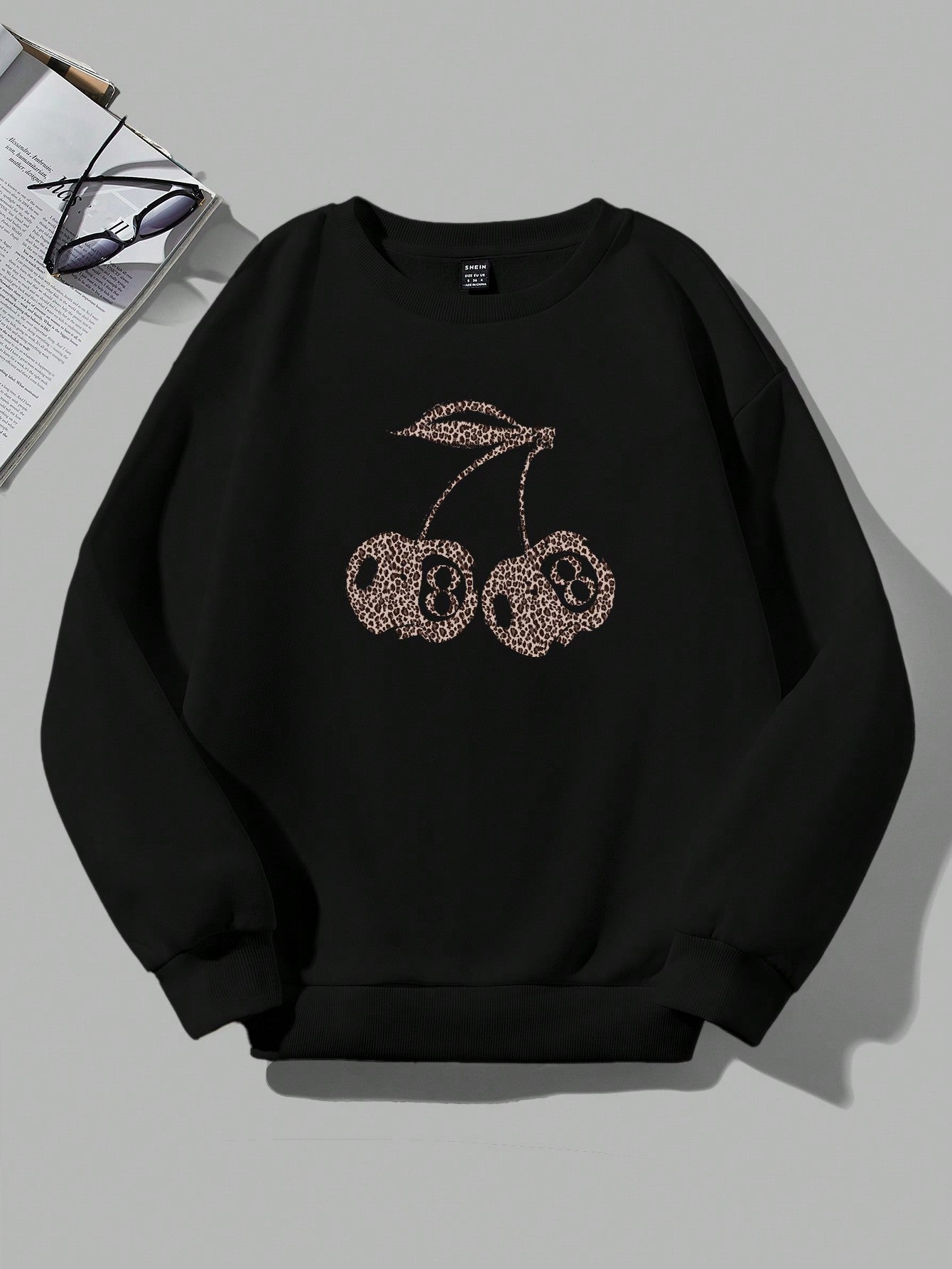 Valenzora | Casual leopard and cherry graphic sweatshirt in black
