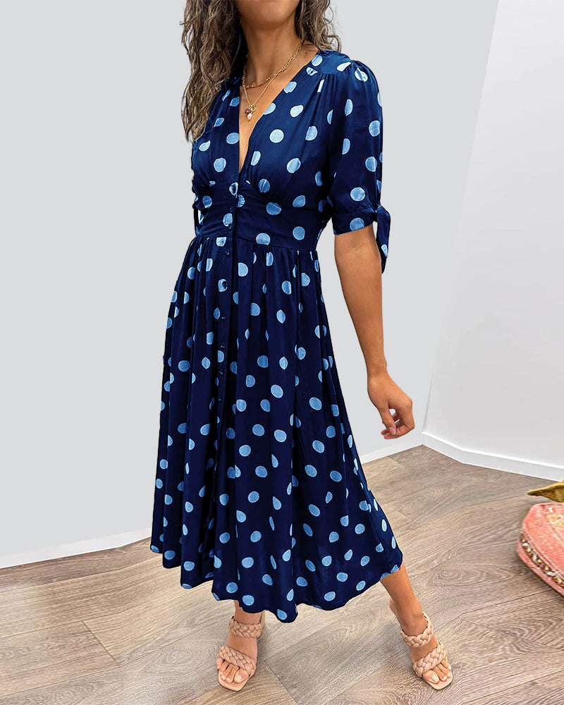 Dress with a deep V-neck and polka dots