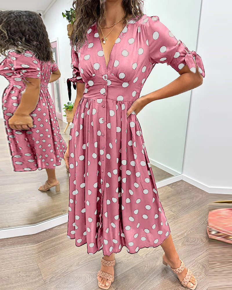 Dress with a deep V-neck and polka dots