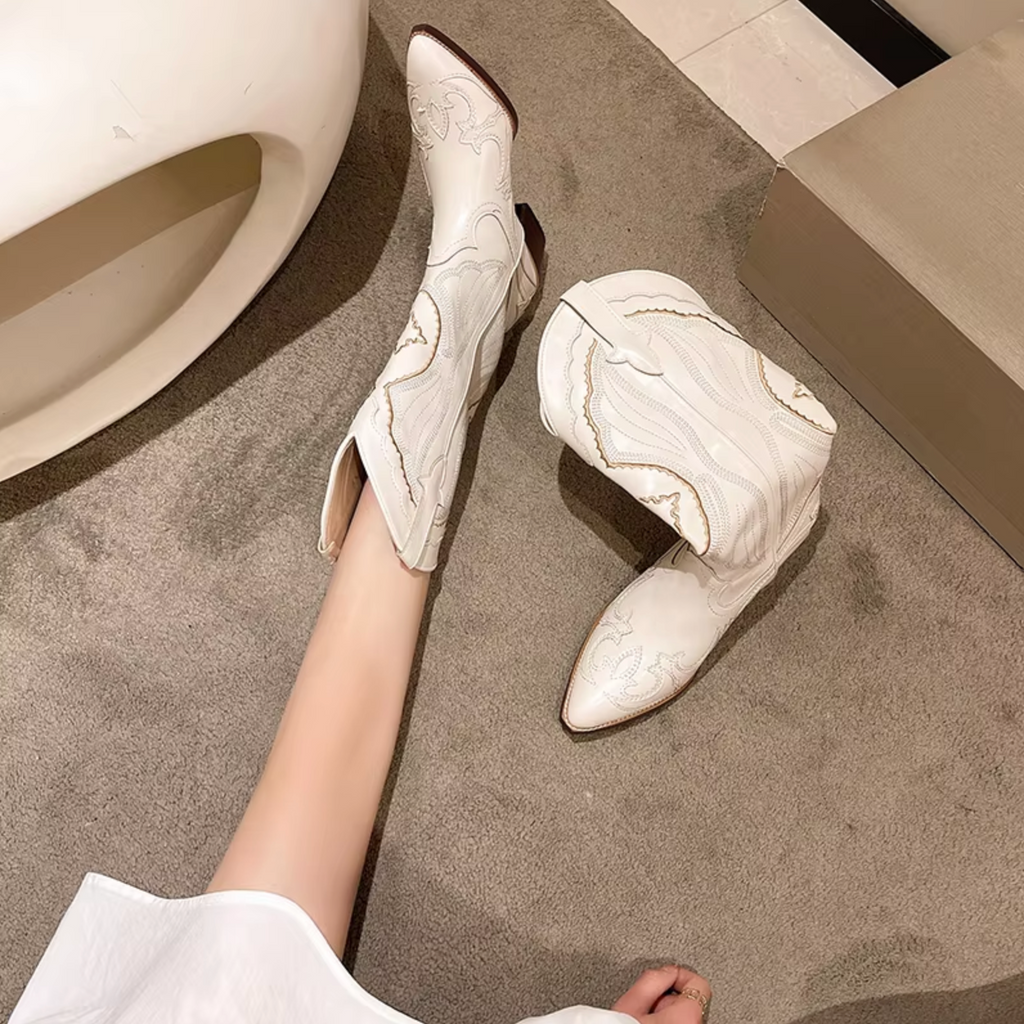 Embroidered leather boots with a mid-calf shaft