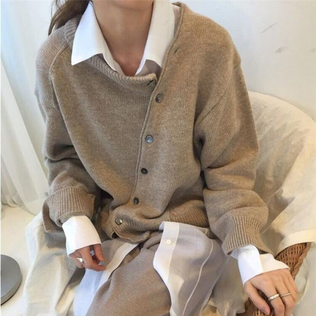 Jacket made of cuddly material with a playful button placket