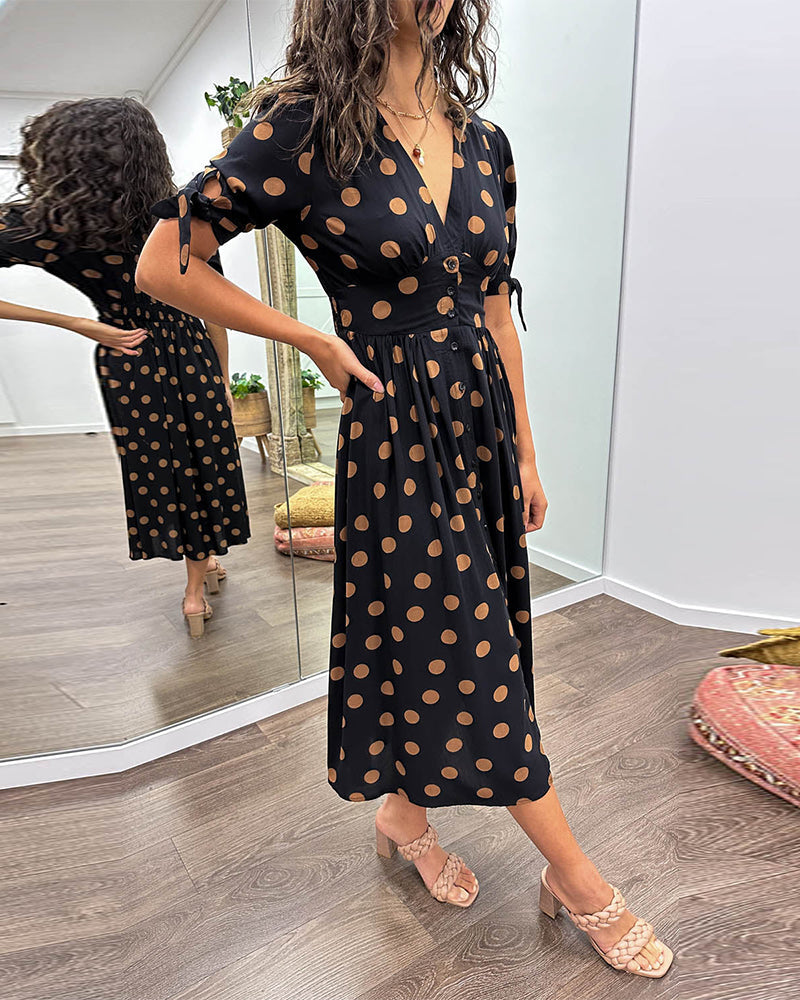 Dress with a deep V-neck and polka dots
