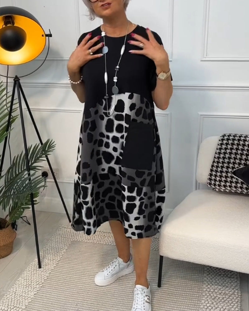 Valenzora | Short-sleeved, printed dress with a round neckline