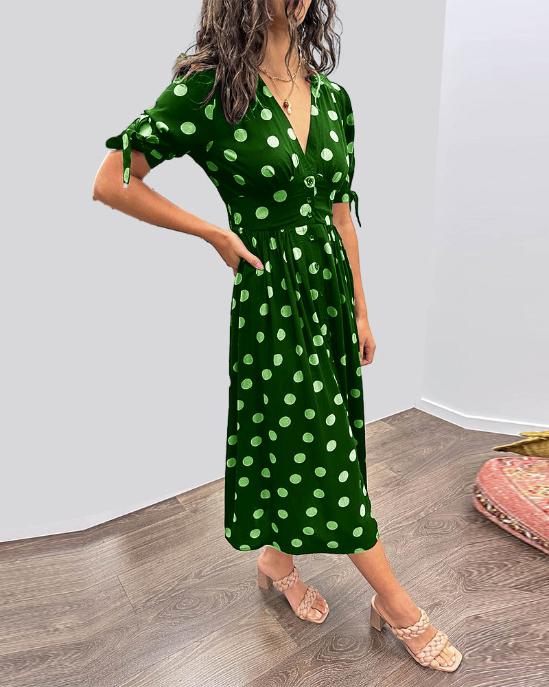 Dress with a deep V-neck and polka dots