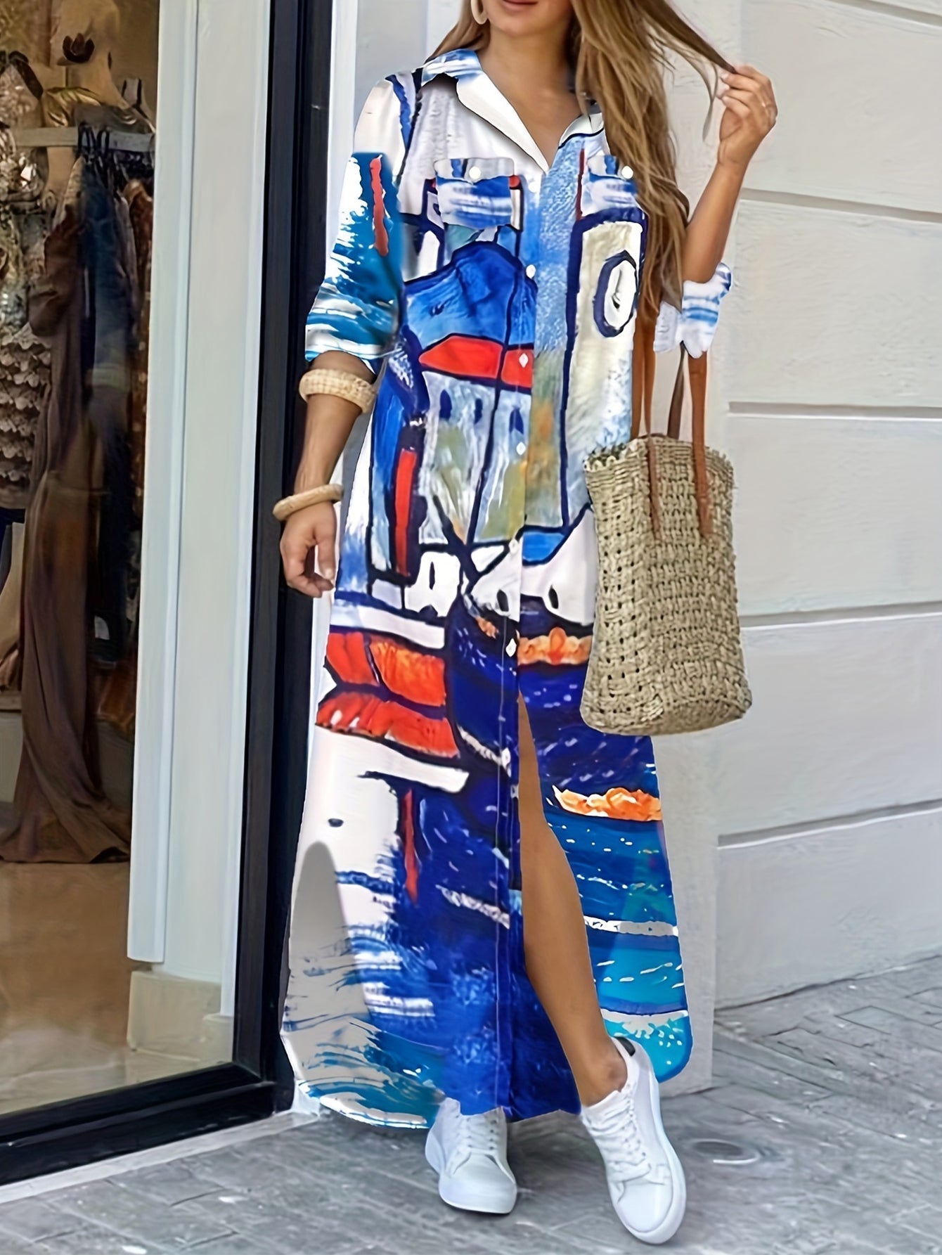 Valenzora | Long-sleeved dress with face pattern in blue and white