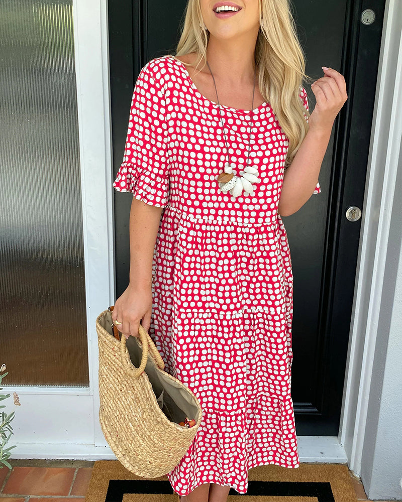 Midi dress with round neckline and polka dot print