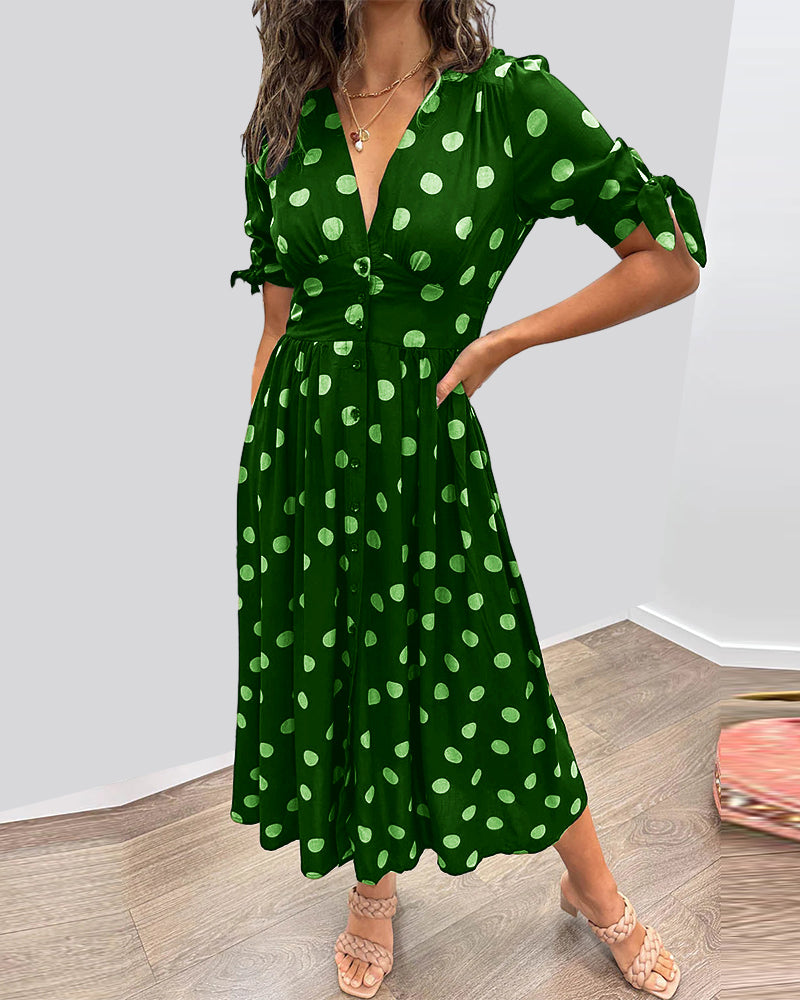 Dress with a deep V-neck and polka dots