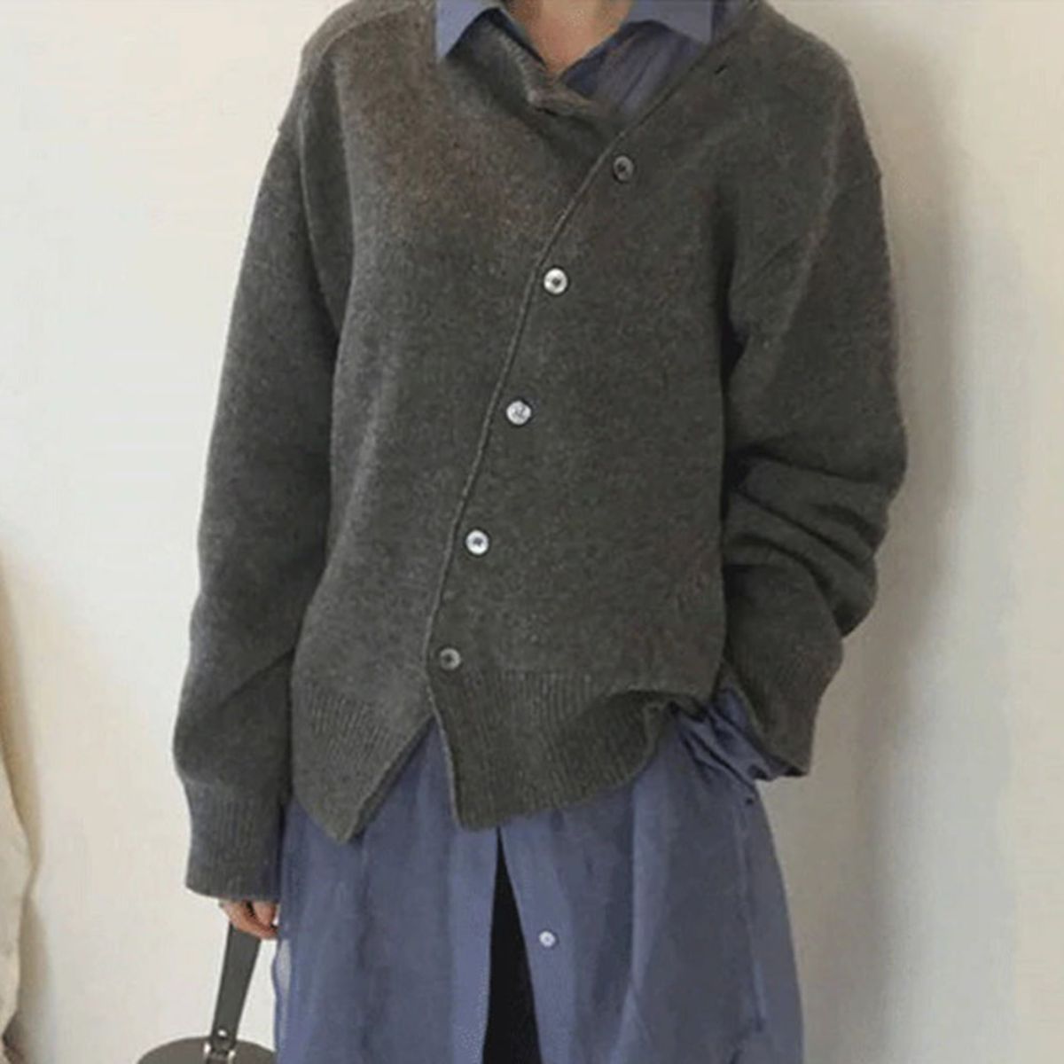 Jacket made of cuddly material with a playful button placket