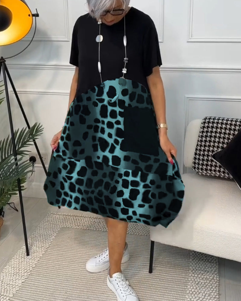 Valenzora | Short-sleeved, printed dress with a round neckline
