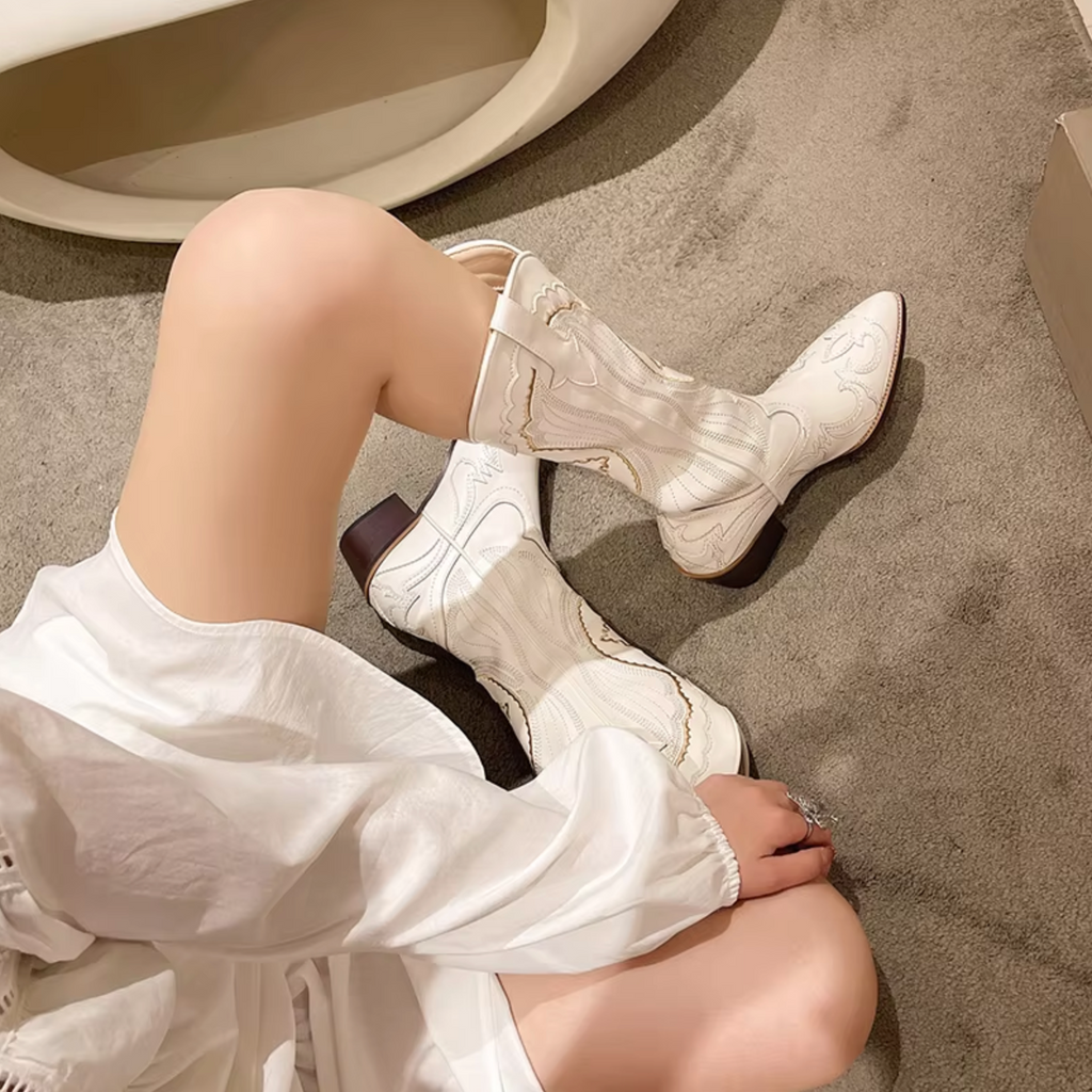 Embroidered leather boots with a mid-calf shaft