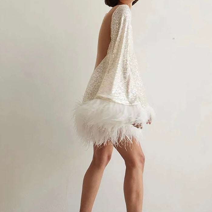 Valenzora | Glamorous sequined dress with feather hem detail