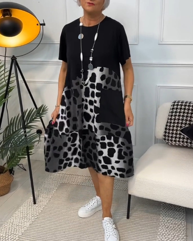 Valenzora | Short-sleeved, printed dress with a round neckline