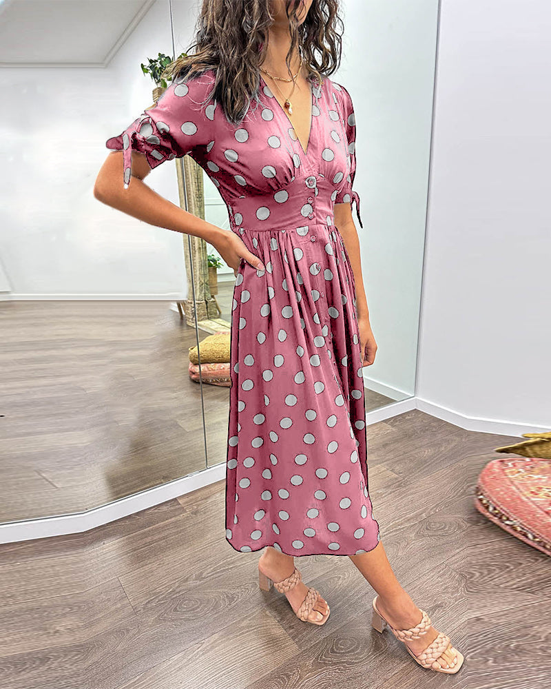Dress with a deep V-neck and polka dots