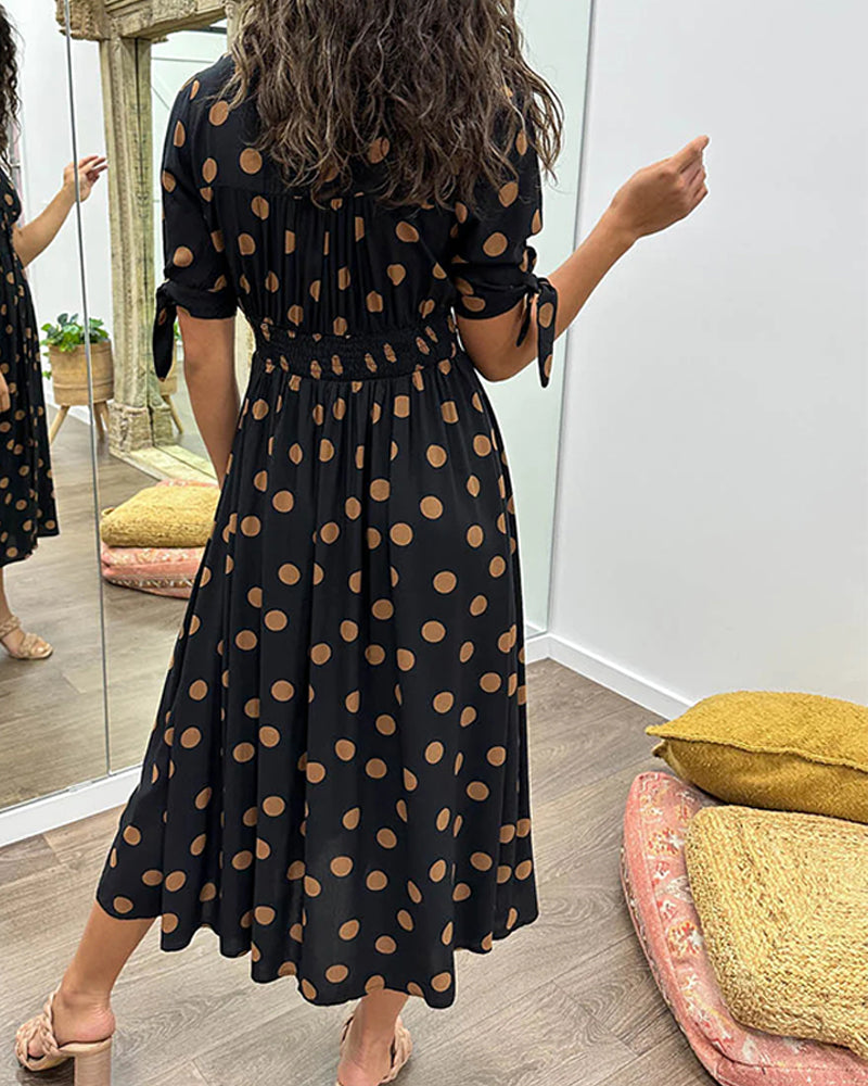 Dress with a deep V-neck and polka dots
