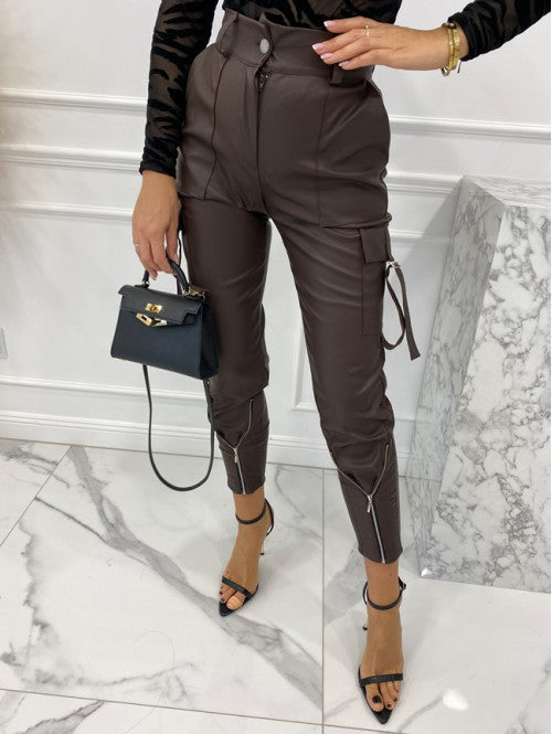 Women's waterproof faux leather cargo pants with zippers and adjustable cuffs, size