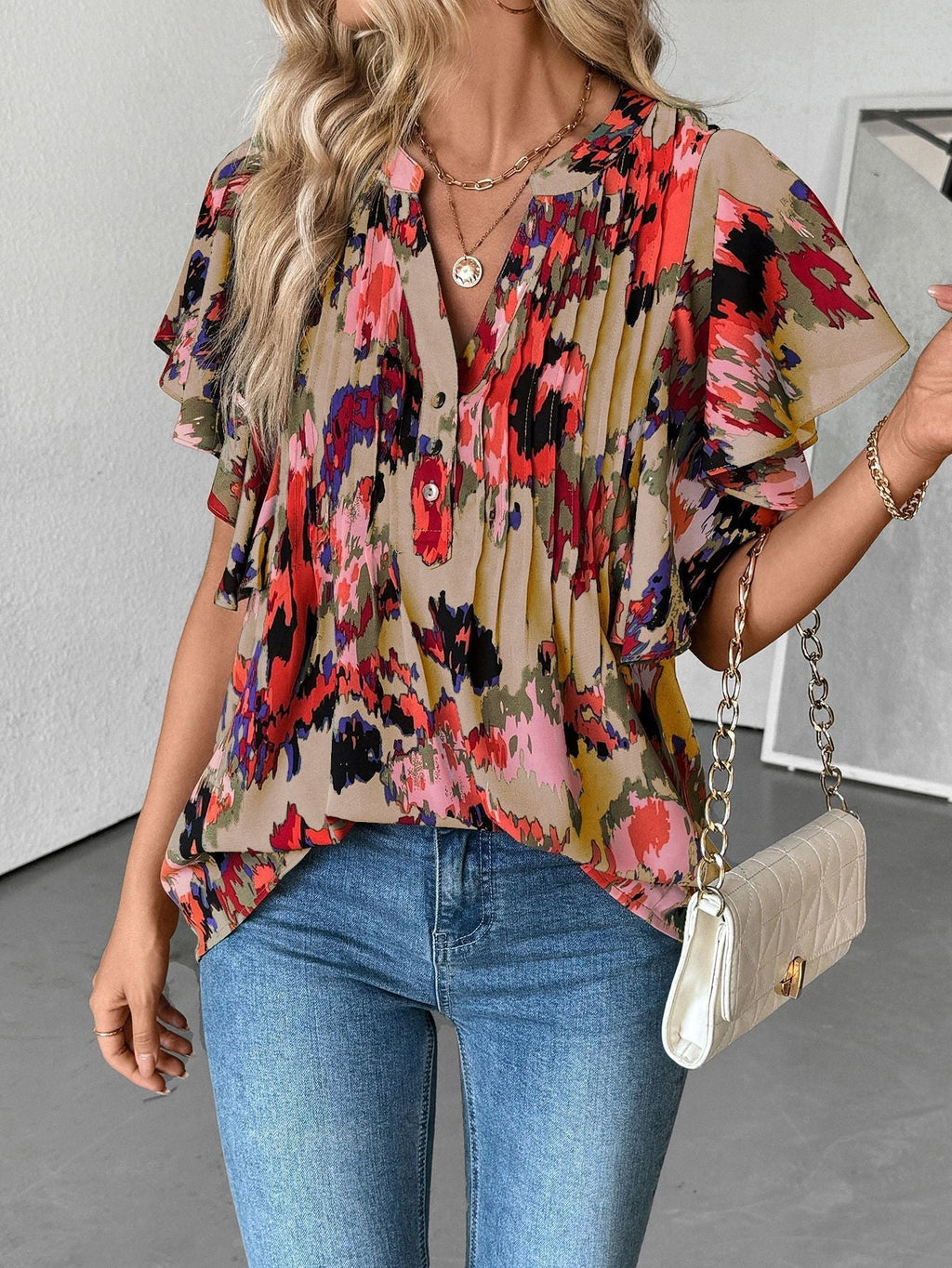Damenbluse mit eleganten Rüschendetails und verspieltem Print, Größe S