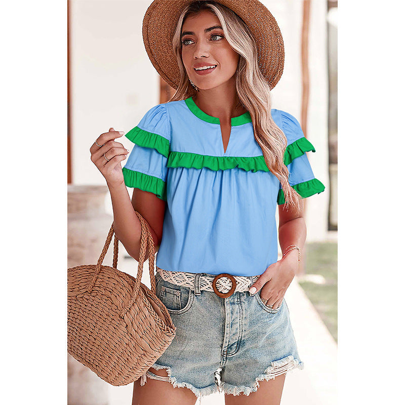 Women's casual blouse with ruffle details and modern accents, size [size missing]