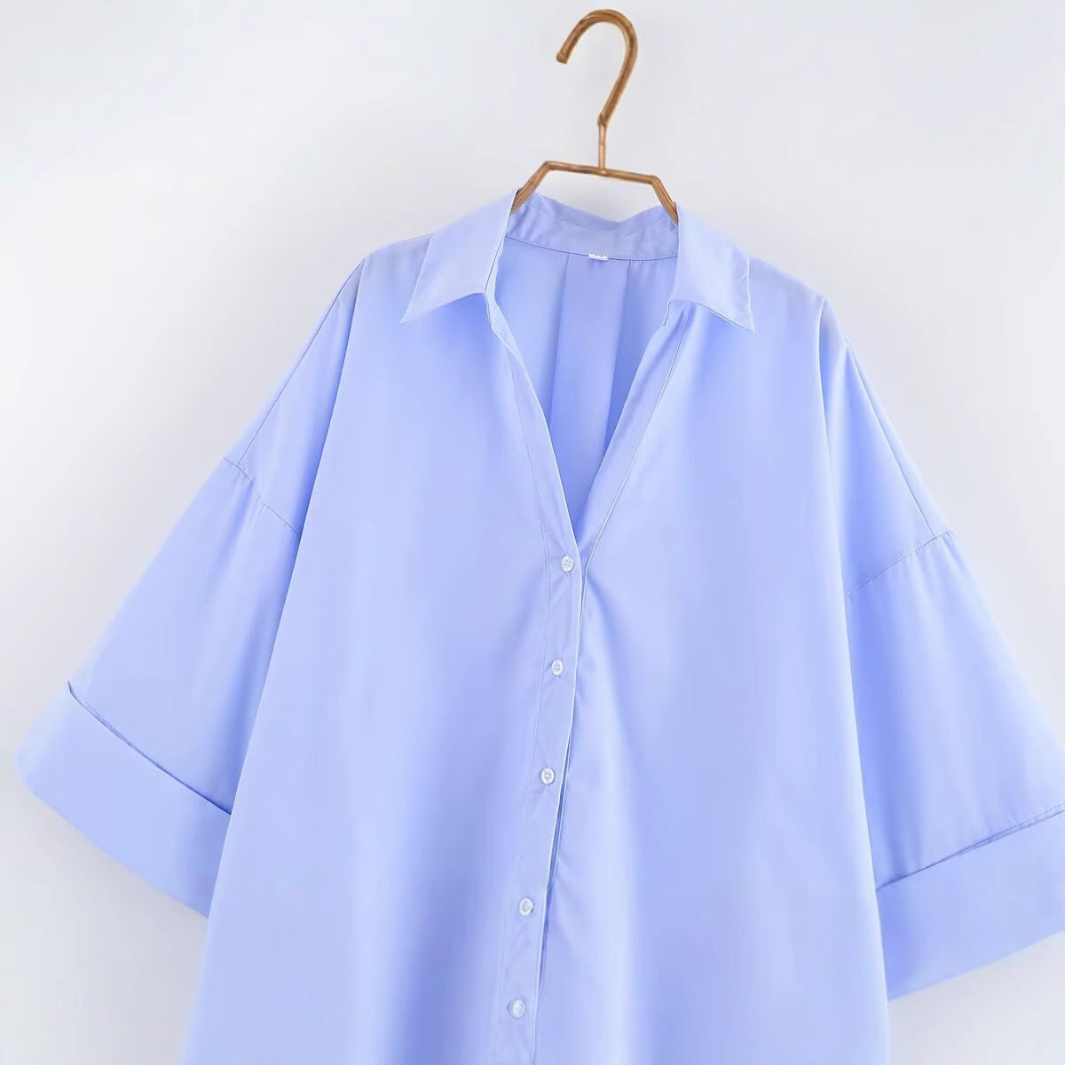 Women's blouse with oversized cut and chic lapel, size