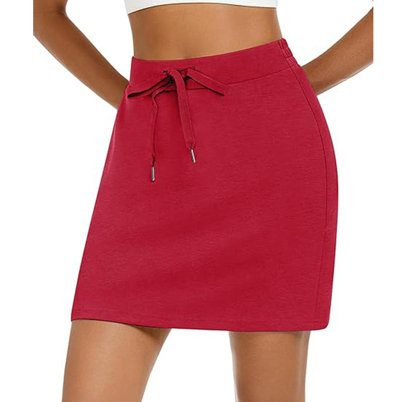 Women's sporty mini skirt with adjustable drawstring and side pockets, size