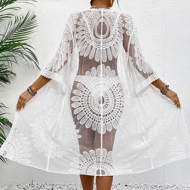 Women's chic crochet beach wrap with voluminous sleeves and elegant design, size S