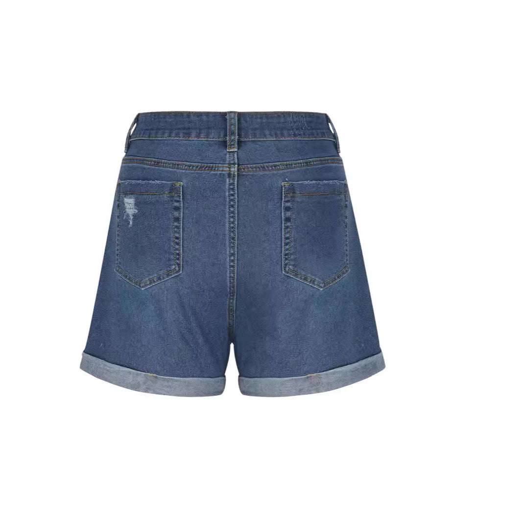 Women's distressed denim shorts with a high waist and frayed hem, size S