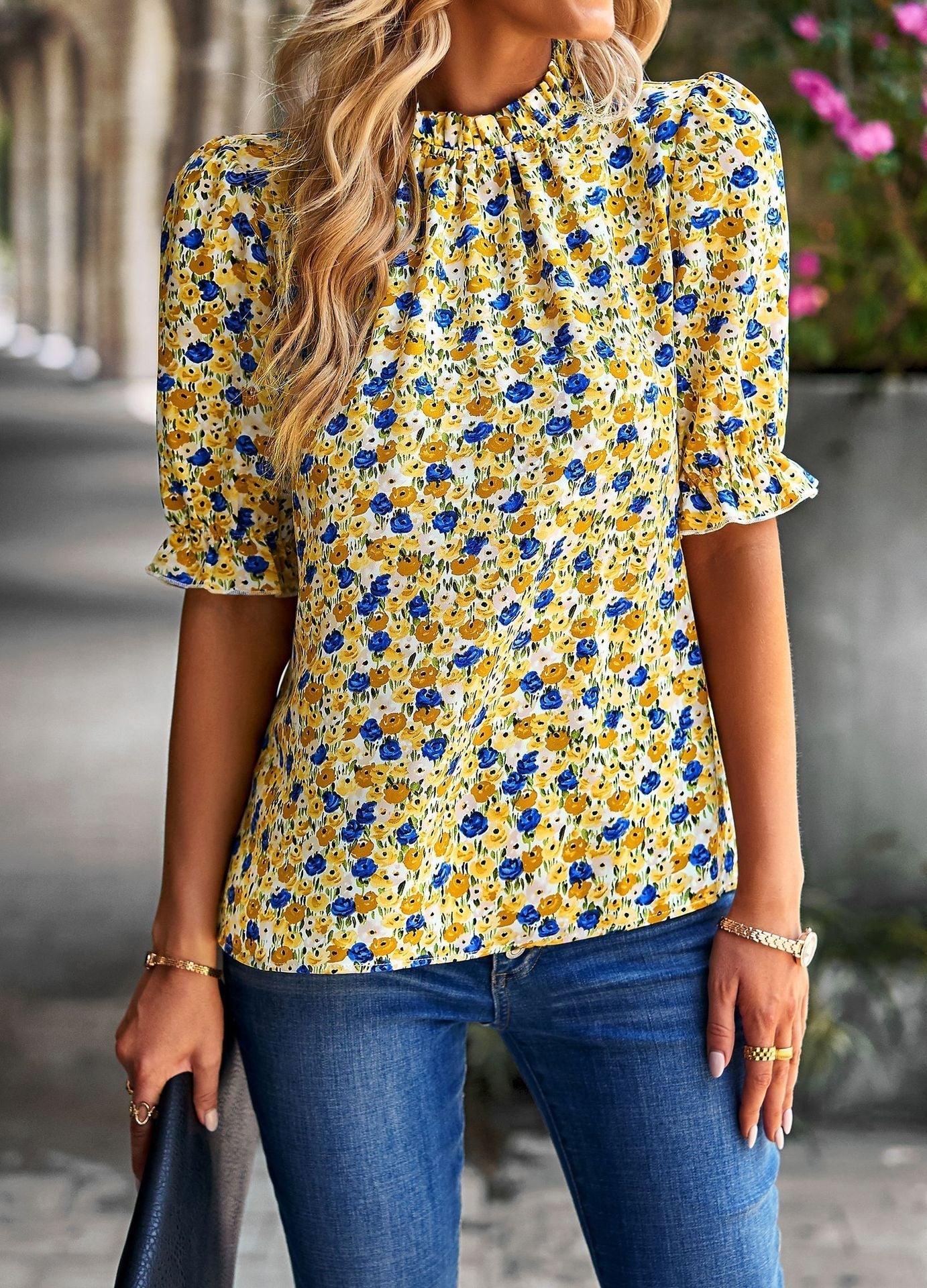Women's blouse with playful floral design and puff sleeves, size
