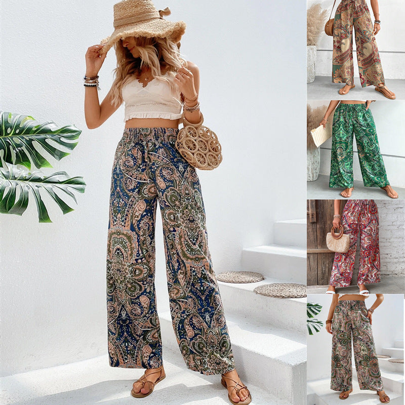 Women's wide-leg palazzo trousers with elasticated waistband and elegant paisley pattern, size S