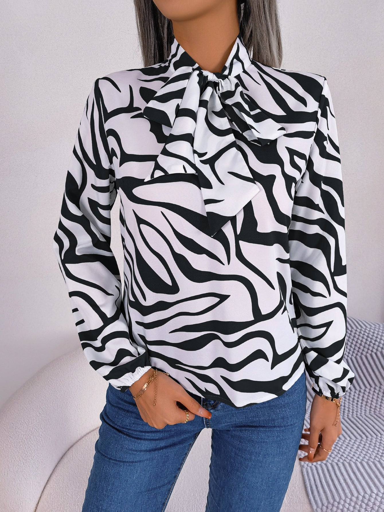 Women's blouse with fashionable zebra pattern and elegant bow collar, size
