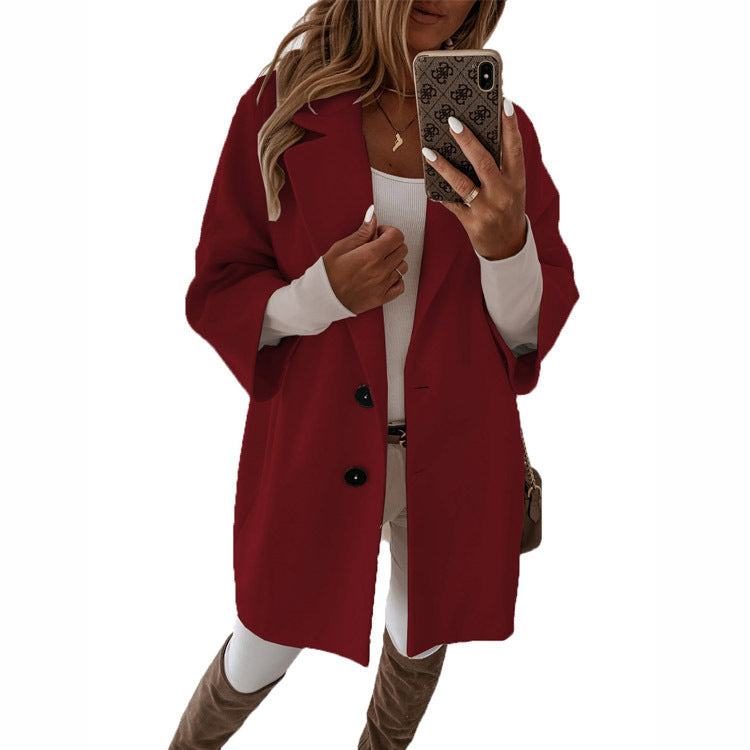 Women's oversized jacket with a modern cut and stylish button details, size [size]