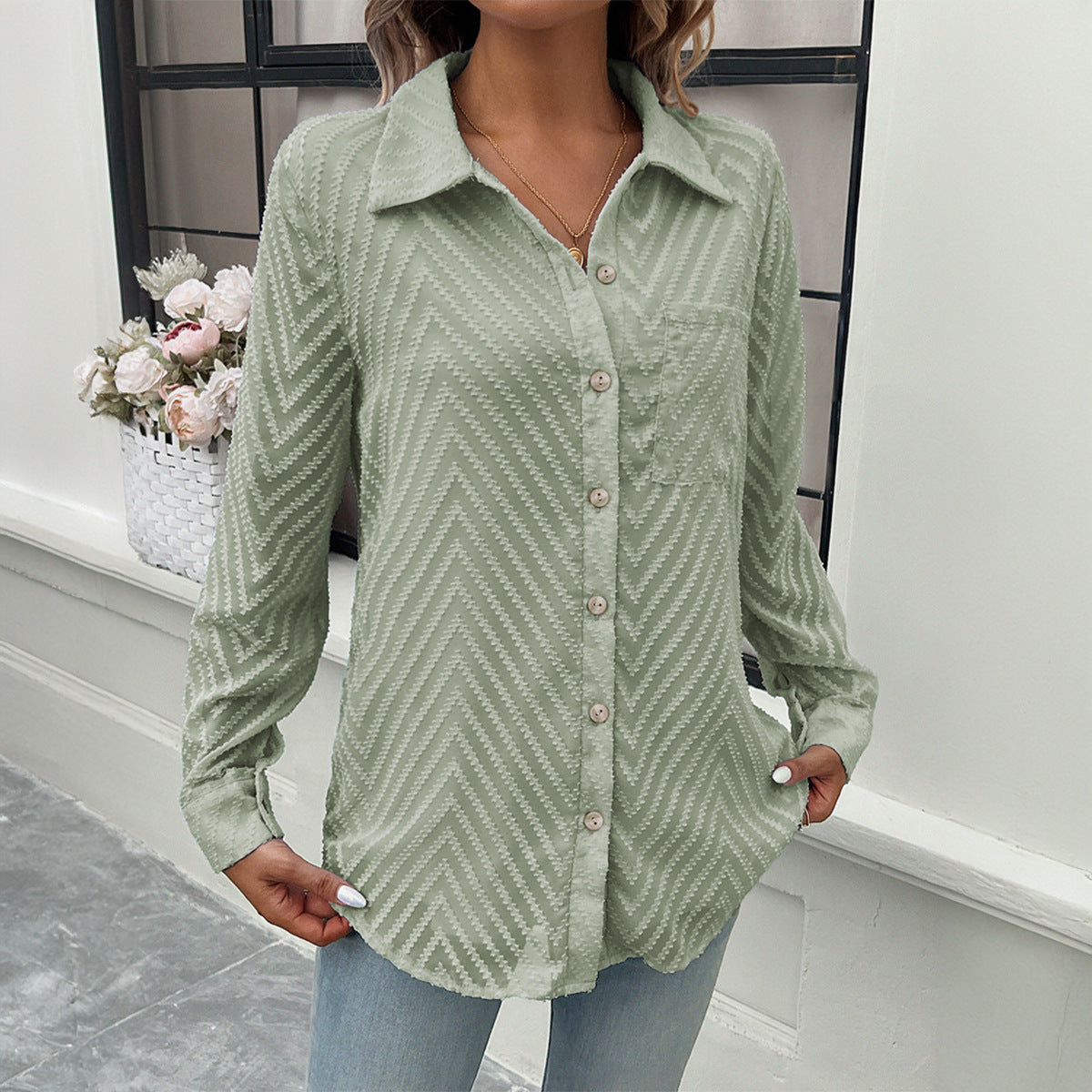 Women's elegant blouse with sheer sleeves and button closures, size [size missing]