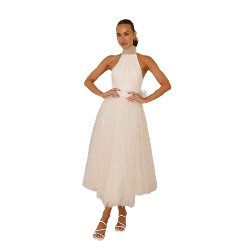 Women's elegant wedding dress with flowing tulle skirt and halter neck design, size S