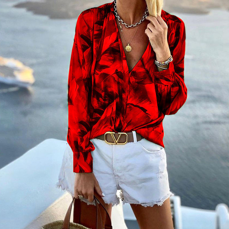 Women's blouse with floral pattern and deep V-neck, size