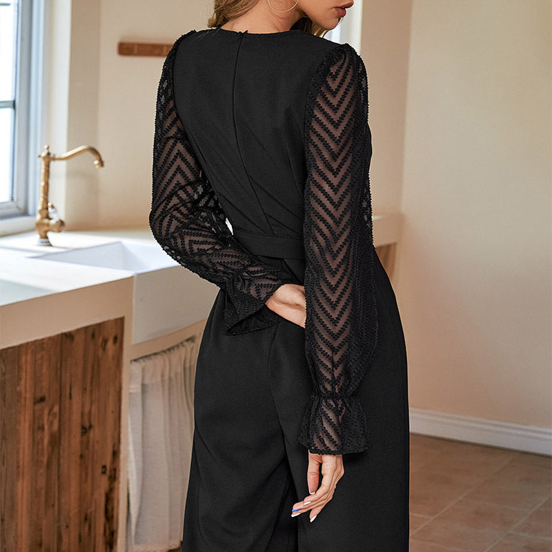Women's elegant jumpsuit with adjustable waist belt and sheer sleeves, size S