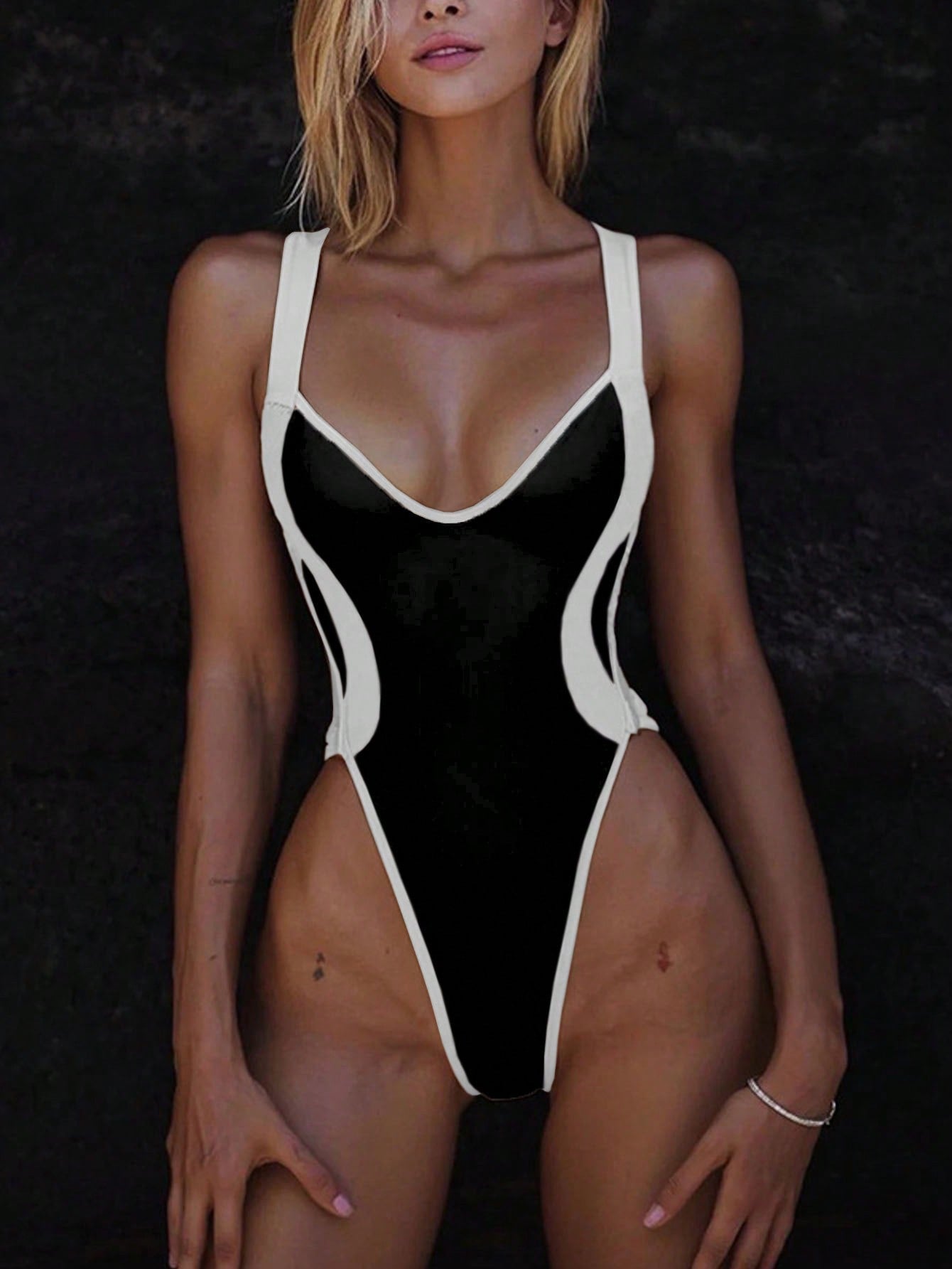Women's high-cut one-piece swimsuit with contrasting seams, size [size]