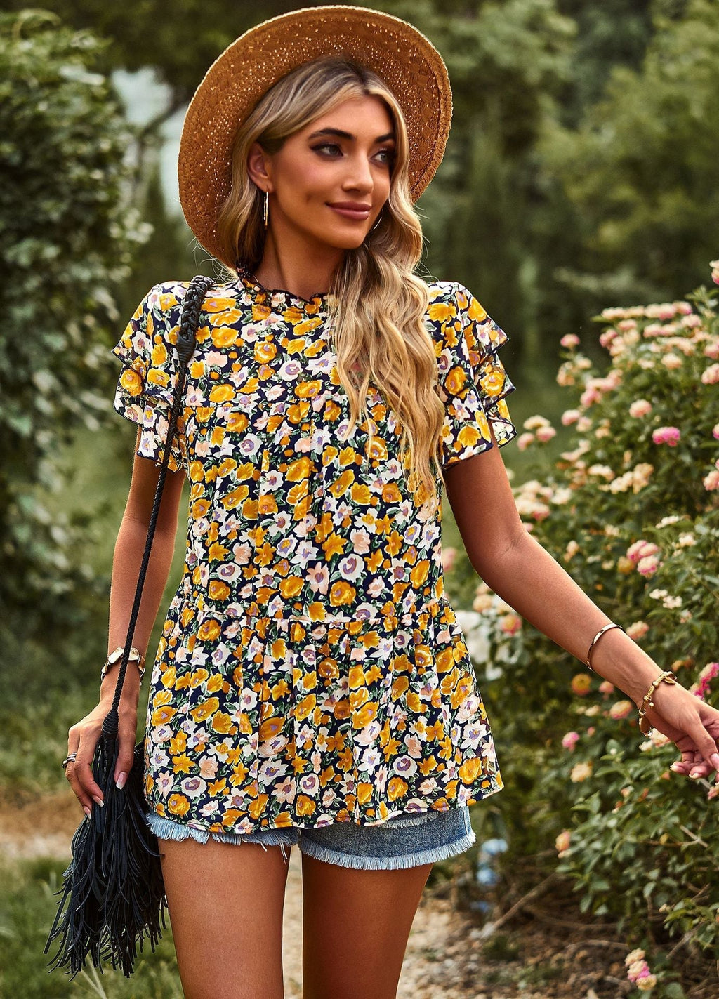 Women's flowy blouse with ruffle details and floral design, size