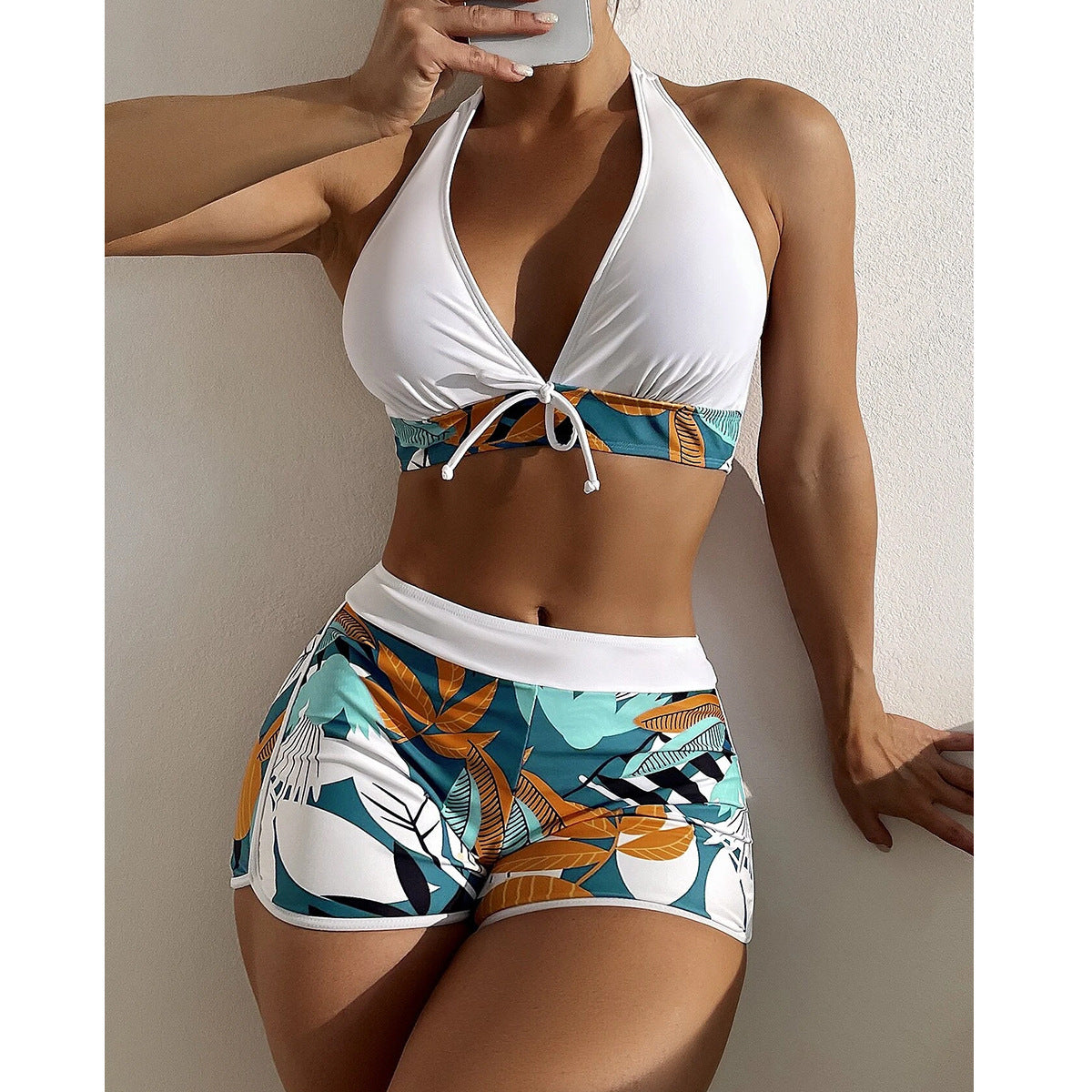 Women's sporty bikini set with woven top and patterned shorts, size [size]