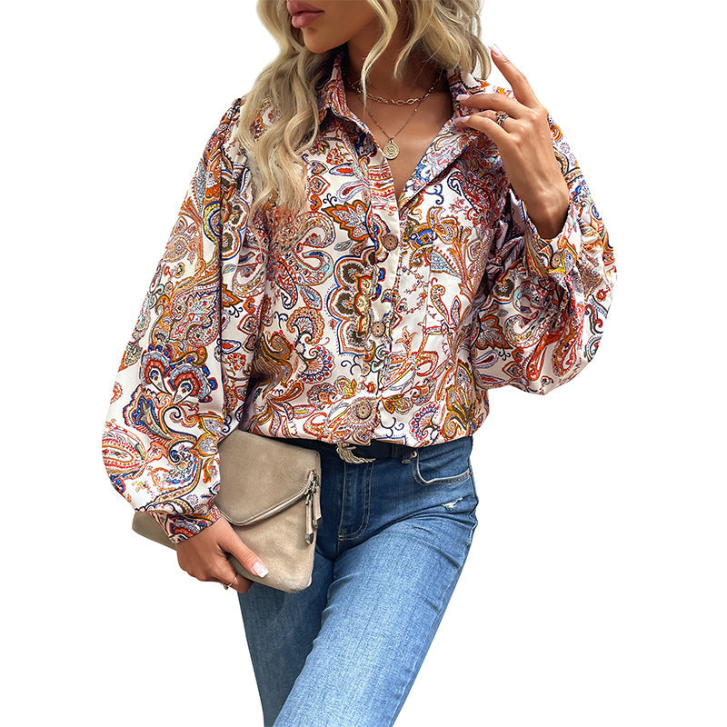 Women's blouse with a striking paisley pattern and voluminous puff sleeves, size [size missing]