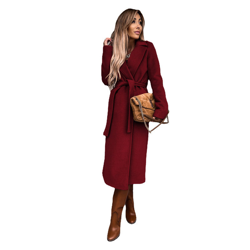 Women's elegant trench coat with tie belt and textured material, size S