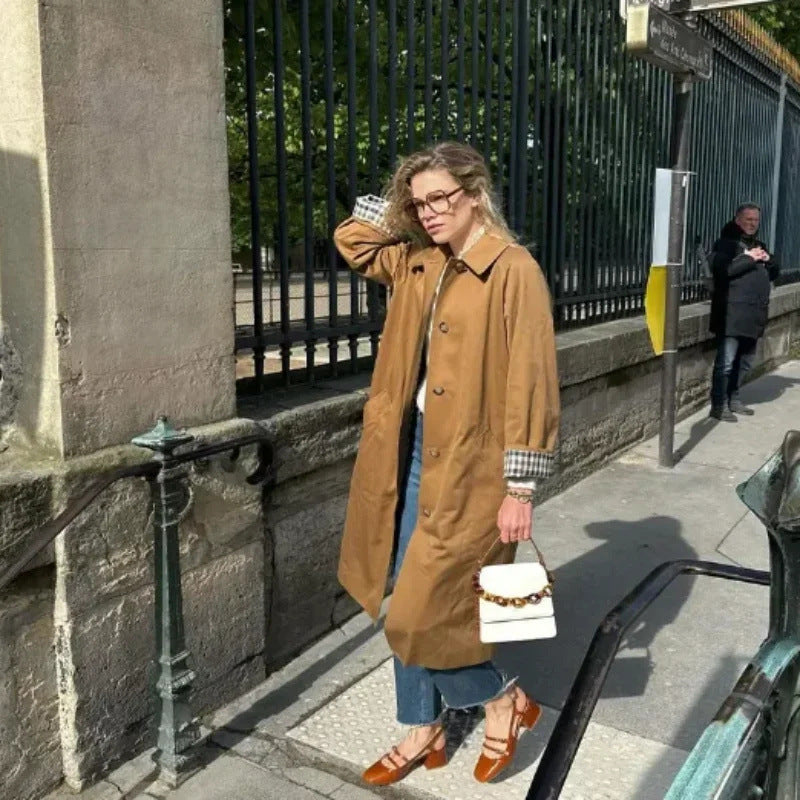 Women's elegant trench coat with a slim fit and practical pockets, size