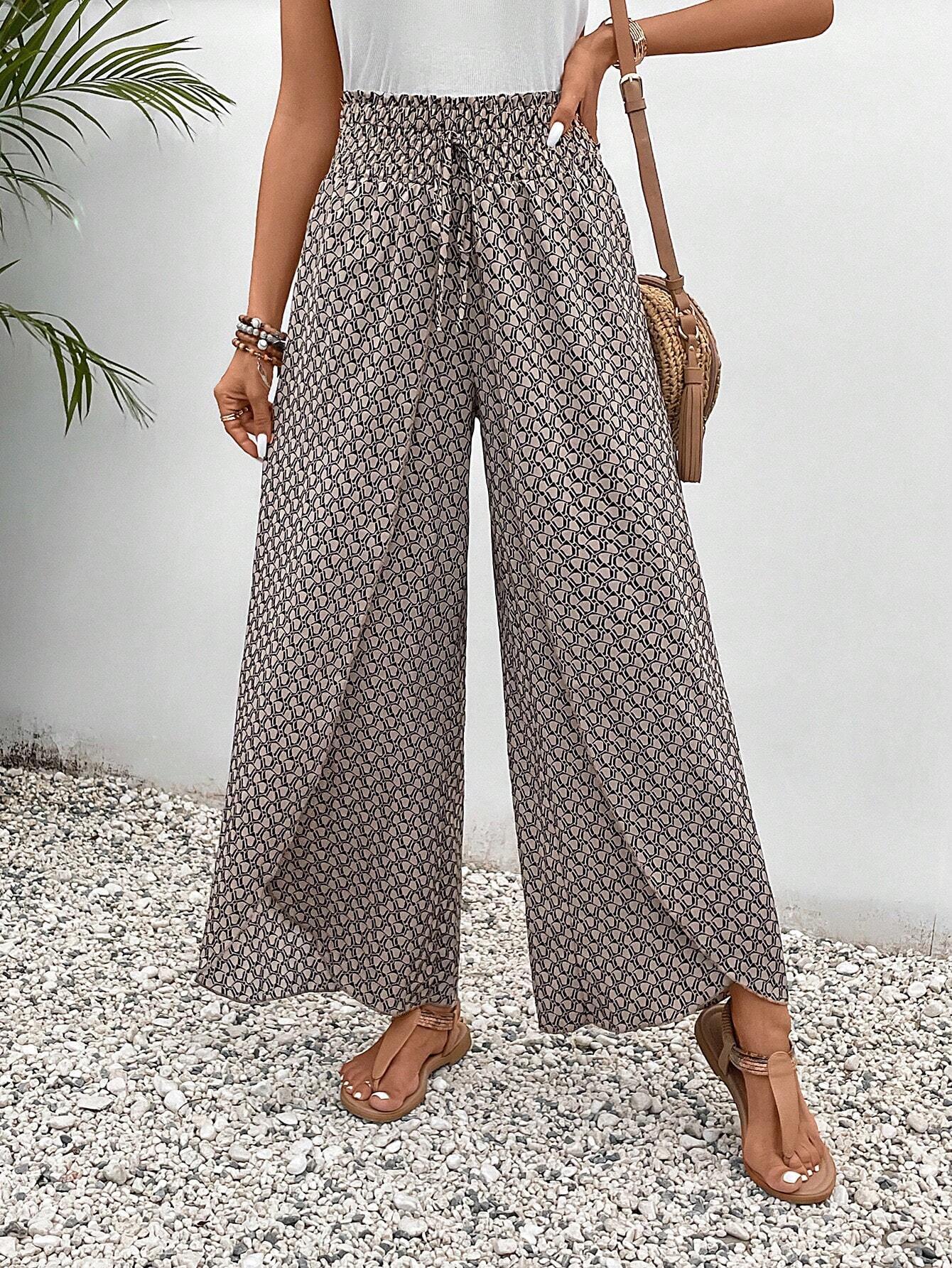Women's wide-leg summer trousers with elasticated waistband and floral design, size S