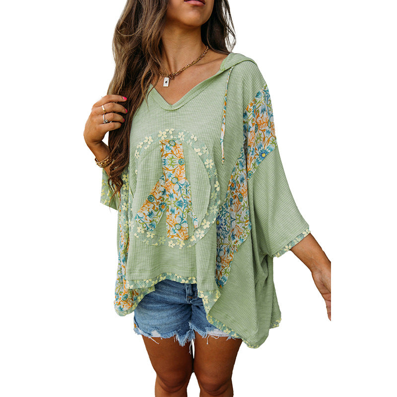 Women's casual hooded top with floral peace design, size S