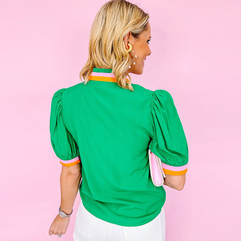 Women's blouse with stylish ruffle details and fashionable color contrast, size [size missing]