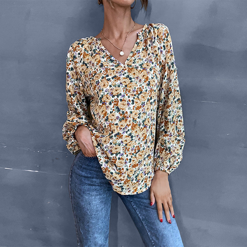 Women's blouse with floral design and elegant puff sleeves, size