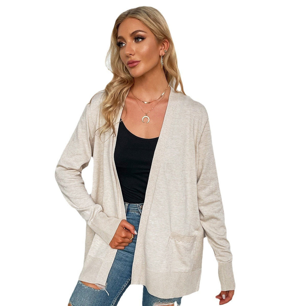 Damen Strickjacke mit tiefem V-Ausschnitt und praktischen Taschen, Größe S