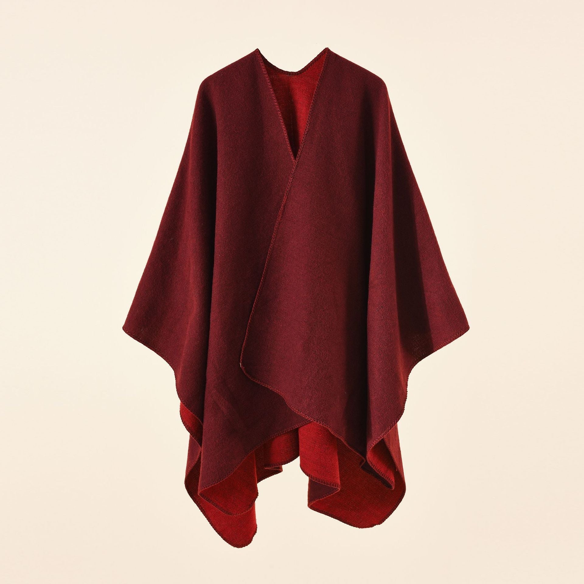 Women's knitted poncho with asymmetrical cut and high warmth retention, size