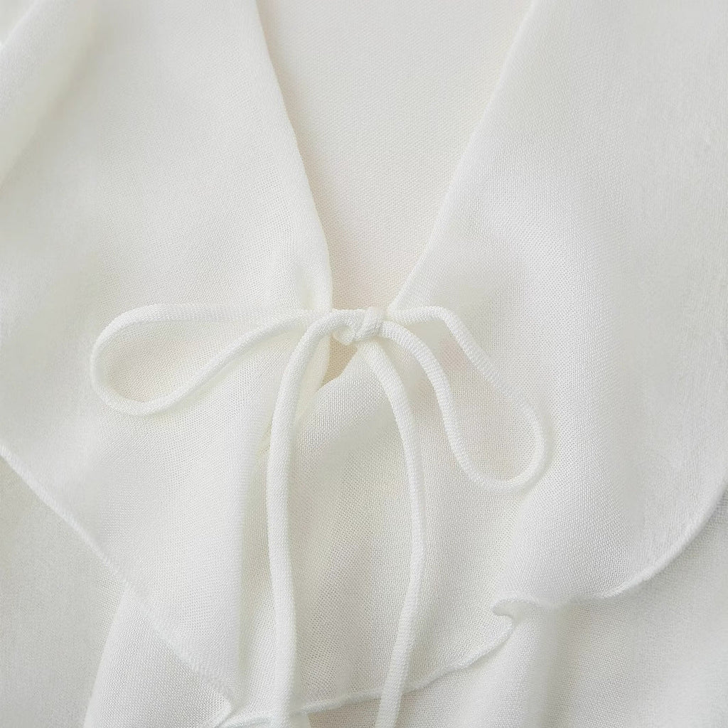 Women's blouse with romantic ruffles and deep V-neck, size